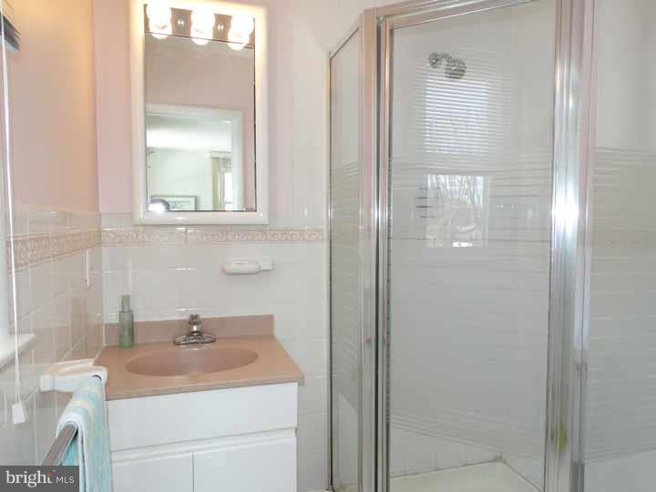 1001 Susan Road Philadelphia, PA 19115 - Photo 13 of 25 a bathroom with a sink toilet and vanity