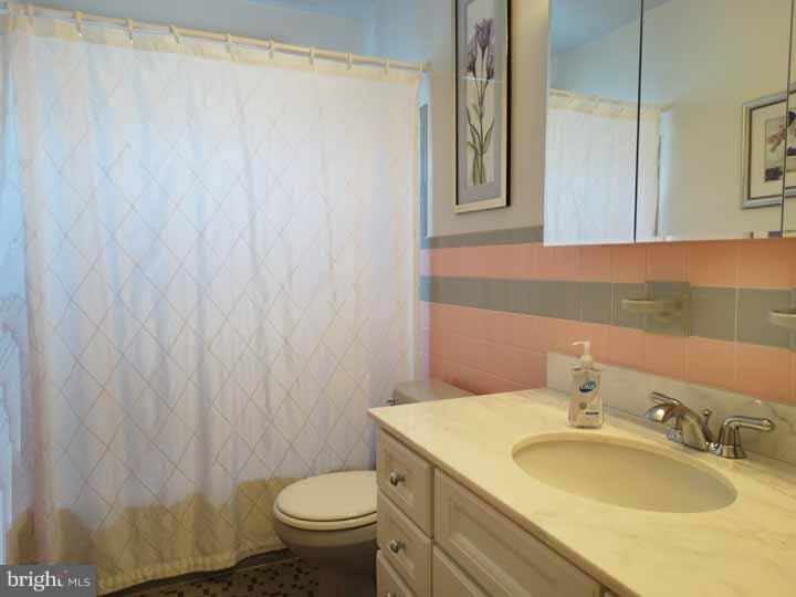 1001 Susan Road Philadelphia, PA 19115 - Photo 15 of 25 a bathroom with a sink toilet and mirror