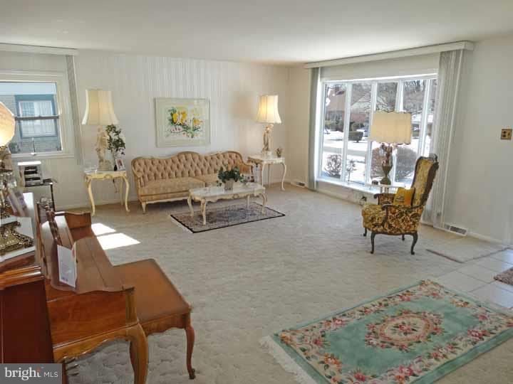 1001 Susan Road Philadelphia, PA 19115 - Photo 4 of 25 a living room with furniture and a table