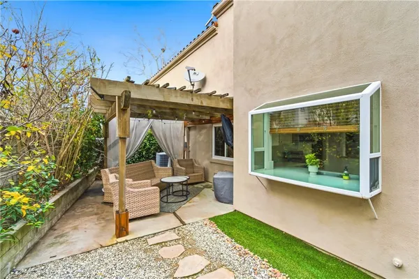 a patio with table and chairs