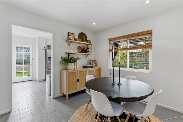 a kitchen with a table and chairs
