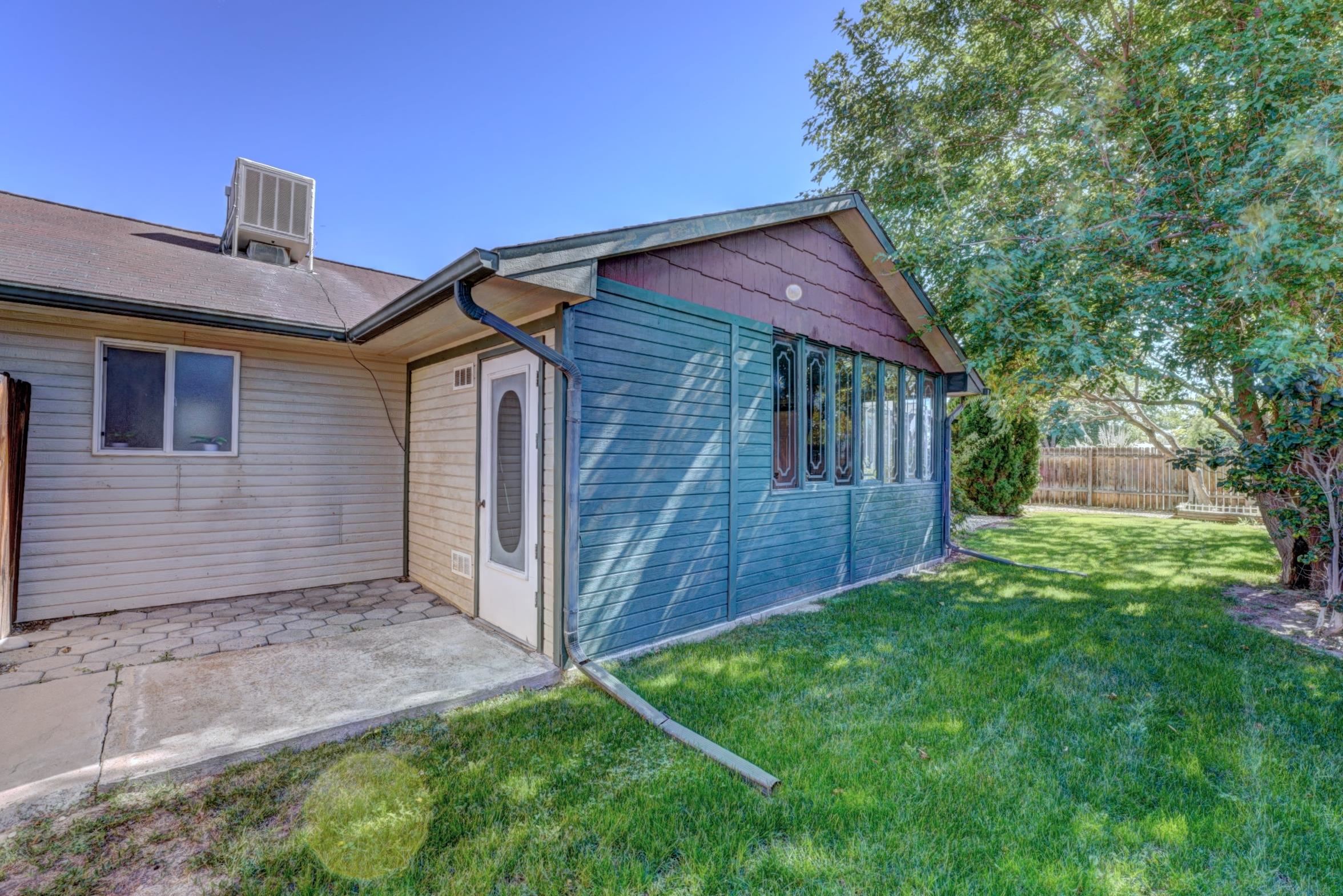 483 Rambling Acres Road Clifton, CO 81520 - Photo 11 of 30 fenced with lots of perennials and shade trees