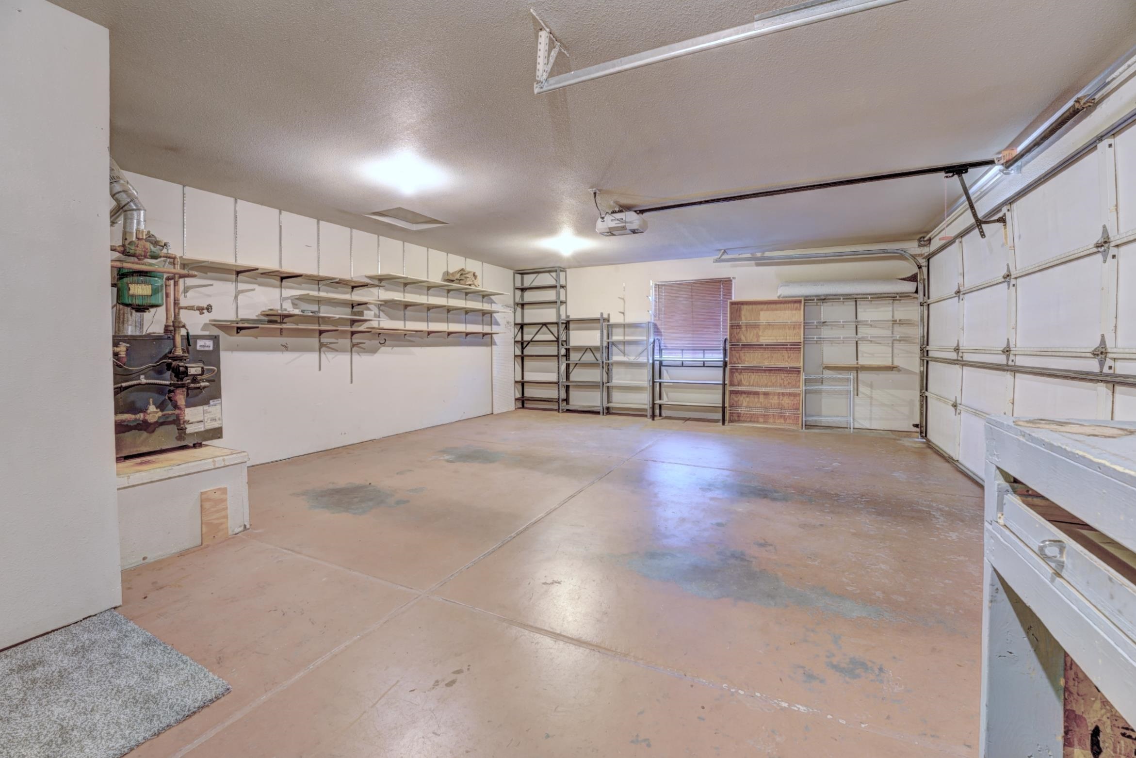 483 Rambling Acres Road Clifton, CO 81520 - Photo 15 of 30 All shelves stay in this oversized 2-car garage