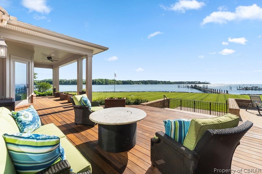 2055 Ditchley Road Kilmarnock, VA 22482 - Photo 7 of 48 Wooden terrace featuring a water view, an outdoor hangout area, and ceiling fan