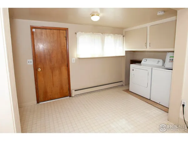 a bathroom with a sink mirror and vanity