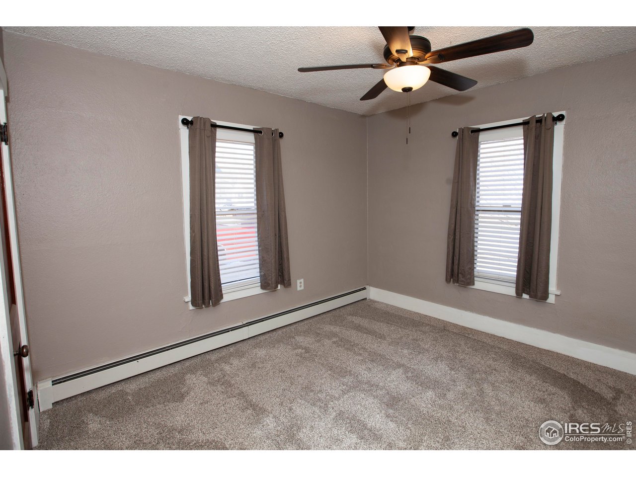 323 Cleveland Street Sterling, CO 80751 - Photo 20 of 28 a view of an empty room with a window