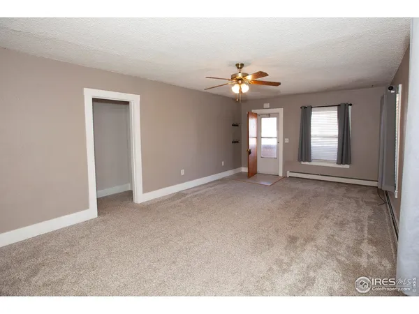 a view of an empty room with a window