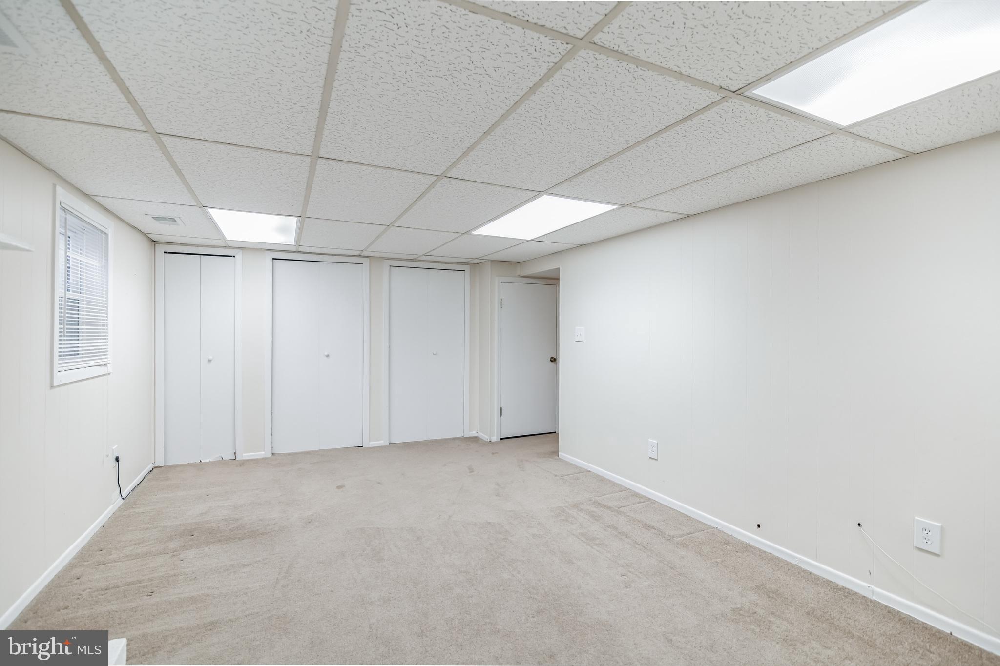 8331 Moline Place Springfield, VA 22153 - Photo 23 of 31 Spacious rec room with a wall of storage