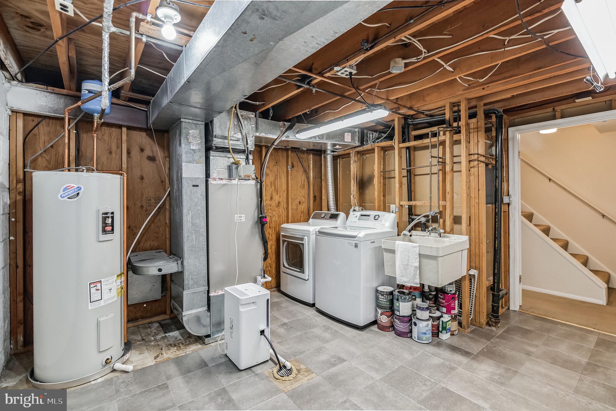 8331 Moline Place Springfield, VA 22153 - Photo 27 of 31 Washer & dryer in the utility area