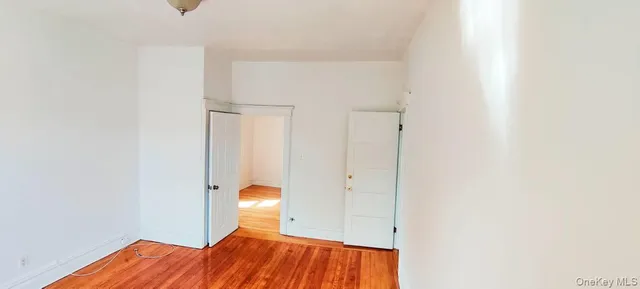 a view of room with wooden floor