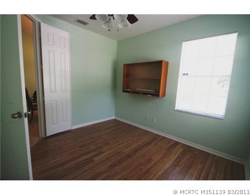 585 Southwest Rustic Circle Stuart, FL 34997 - Photo 13 of 16 Studio/Study/Office. Office with upgraded pecan flooring