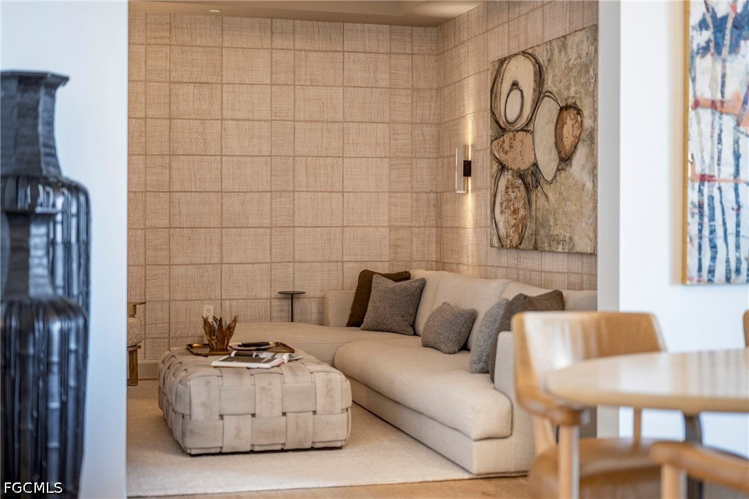 1115 Central Avenue, Unit 443 Naples, FL 34102 - Photo 19 of 40 a living room with furniture and a wall painting