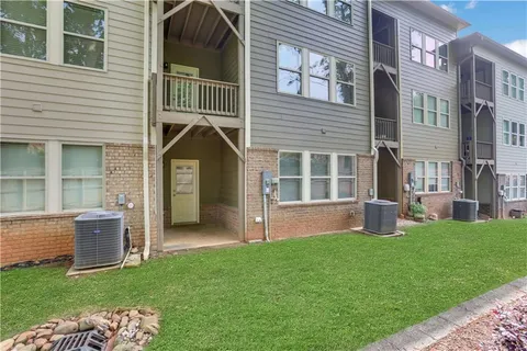 a view of a balcony with wooden floor