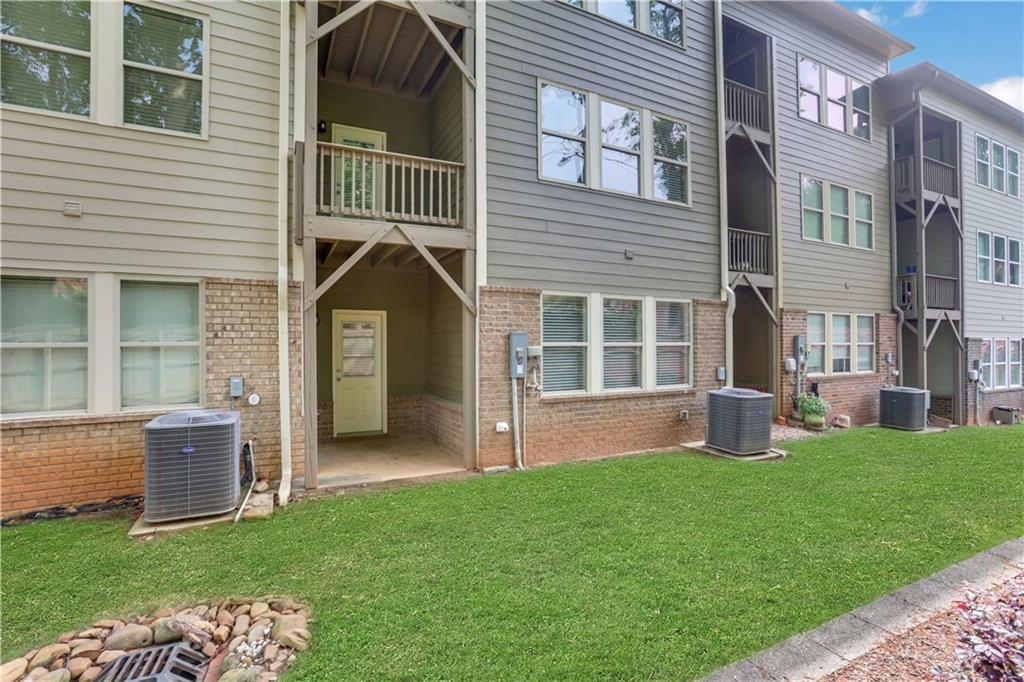 1300 Hopkins Drive Decatur, GA 30033 - Photo 27 of 30 a front view of a house with a garden and yard