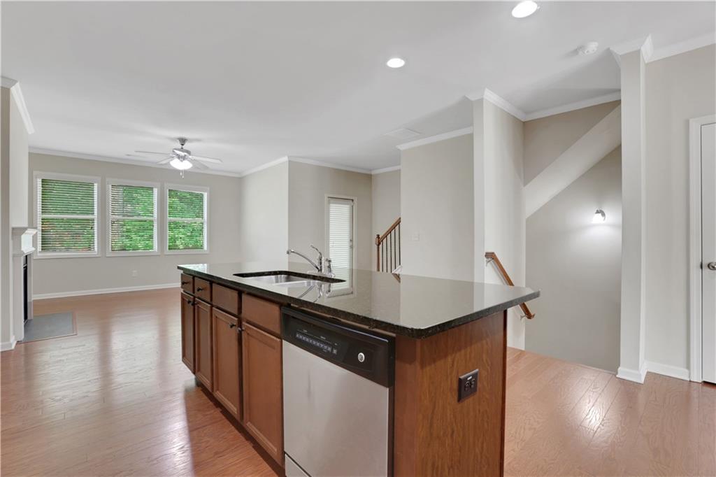 1300 Hopkins Drive Decatur, GA 30033 - Photo 7 of 30 a kitchen with stainless steel appliances granite countertop a sink a stove and a wooden floors