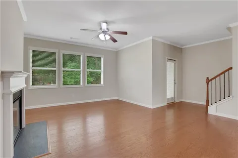 wooden floor in an empty room with a window