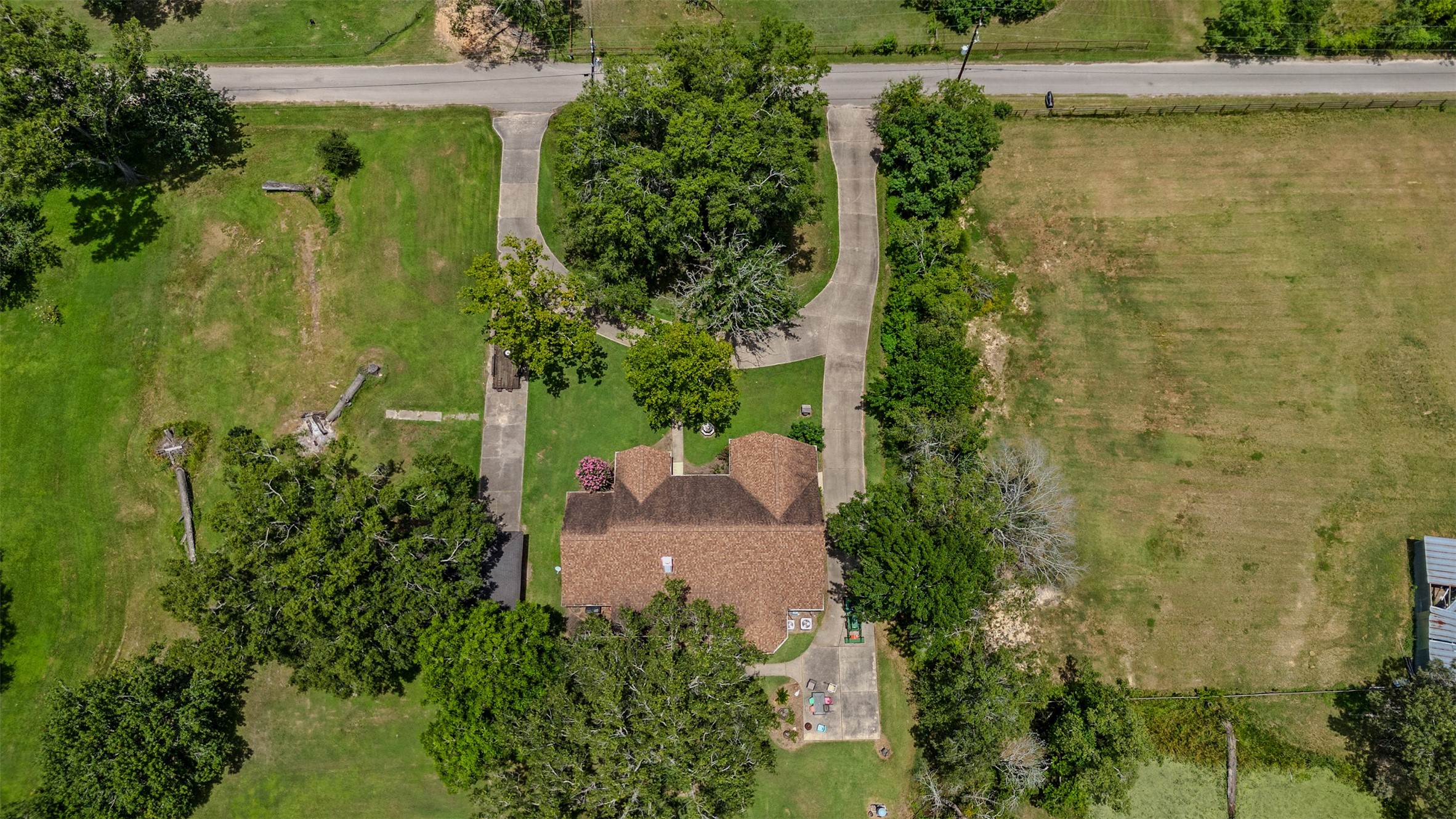11692 Clark Lane Conroe, TX 77385 - Photo 29 of 35 Aerial view of the home with circle driveway.