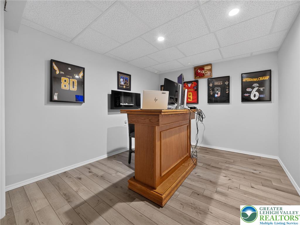 4148 Ross Road Bethlehem, PA 18020 - Photo 66 of 67 A well-appointed recreation room boasts durable wood flooring, ideal for entertaining.