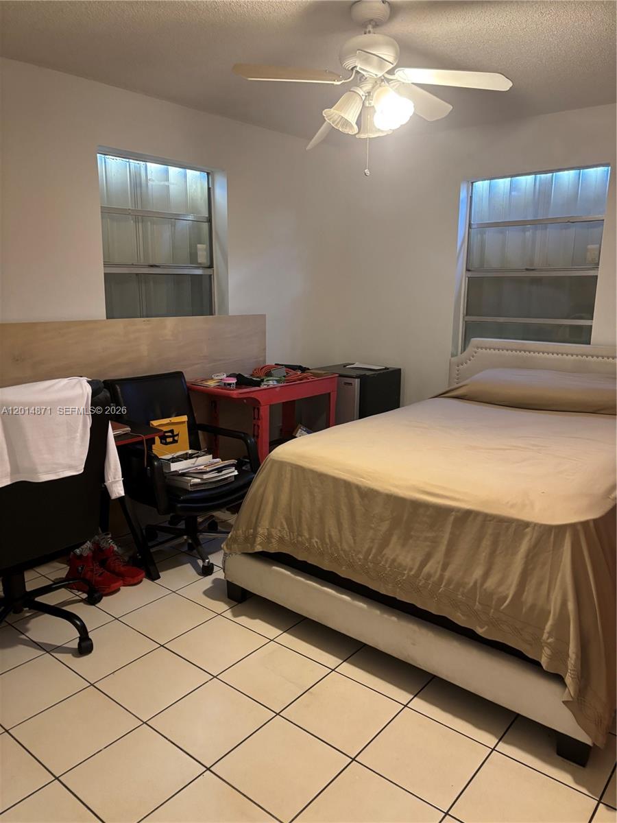 116 Allen Road West Park, FL 33023 - Photo 11 of 15 a bedroom with a bed and a cabinets