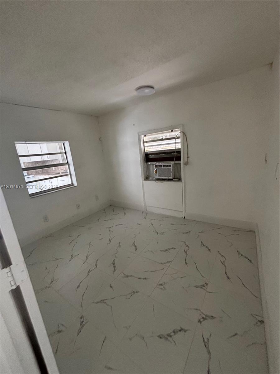 116 Allen Road West Park, FL 33023 - Photo 3 of 15 a view of empty room with windows