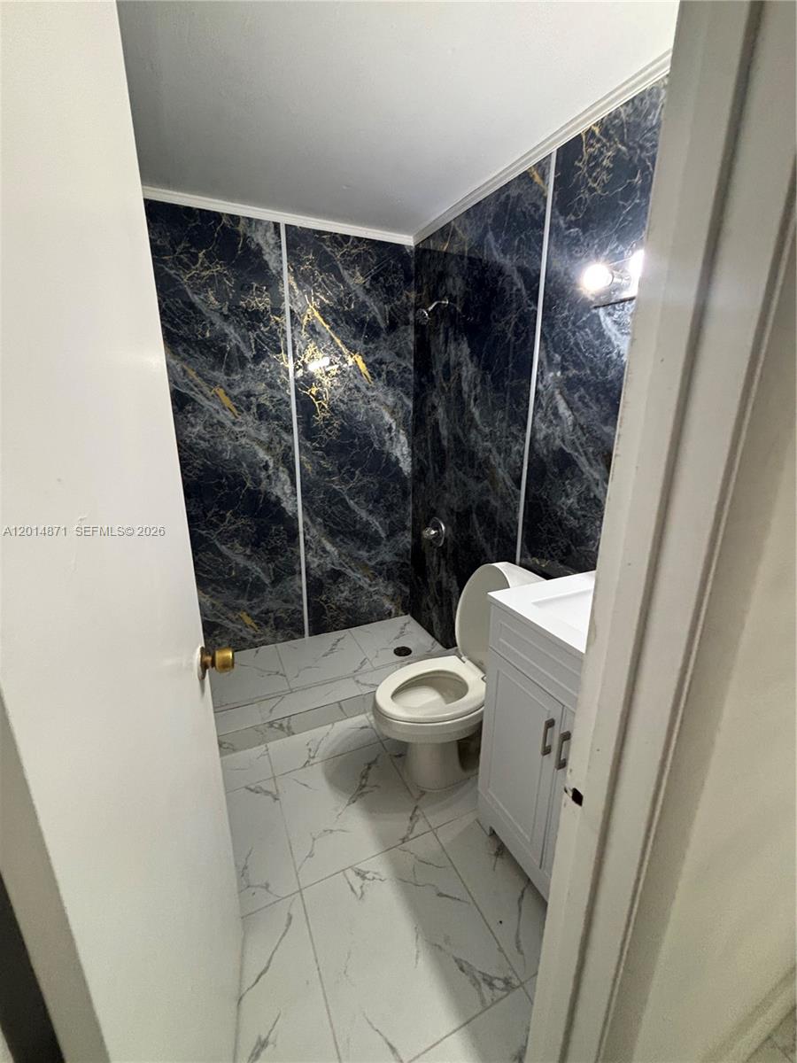 116 Allen Road West Park, FL 33023 - Photo 4 of 15 a bathroom with a toilet and a shower