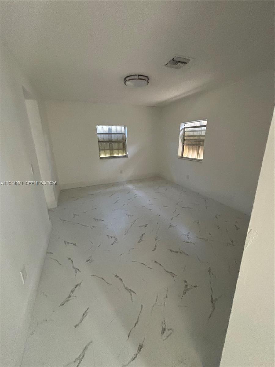116 Allen Road West Park, FL 33023 - Photo 5 of 15 en empty room with windows