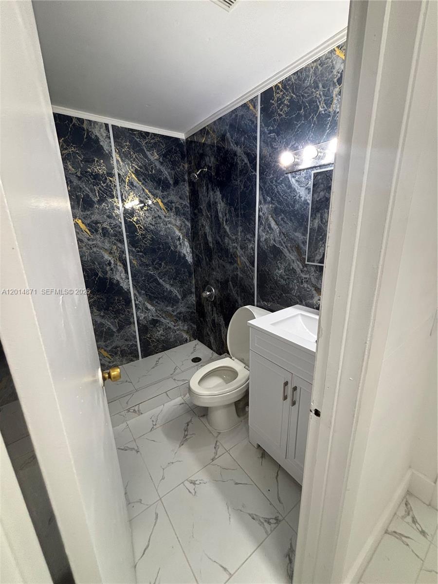 116 Allen Road West Park, FL 33023 - Photo 7 of 15 a bathroom with a toilet and a shower