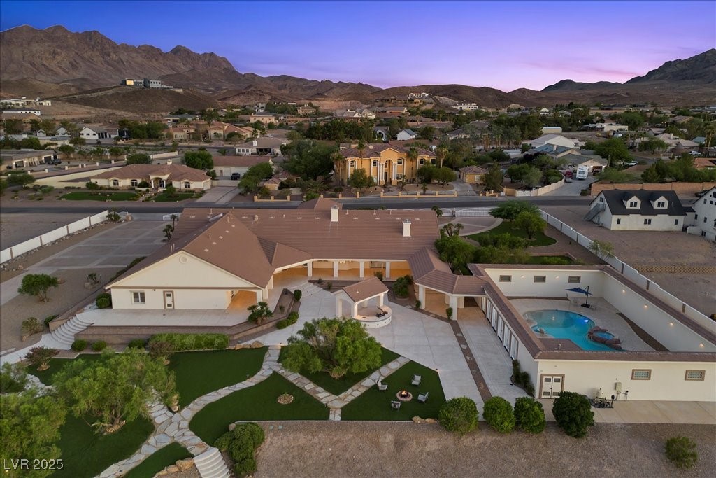 640 Quail Covey Road Henderson, NV 89002 - Photo 68 of 75 Aerial view at dusk from back of property of a mountain view, a residential view, and view of pool area