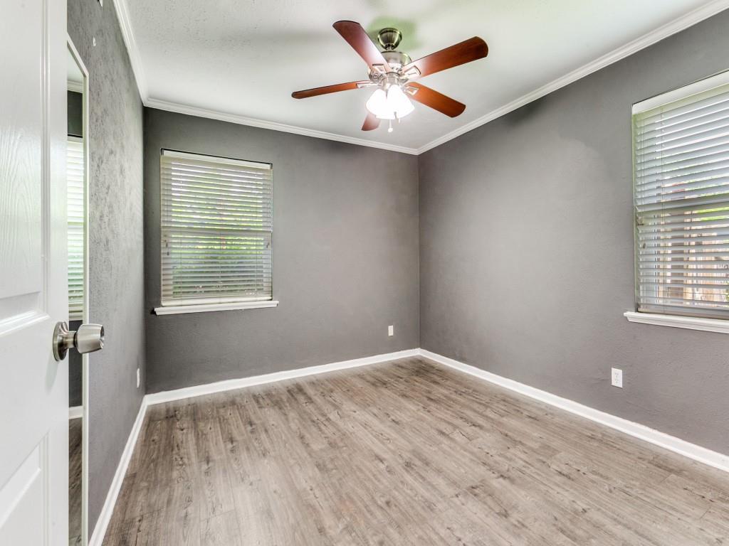 1106 Ridgeway Circle Richardson, TX 75080 - Photo 18 of 25 Unfurnished room with crown molding, a ceiling fan, and light wood-style floors