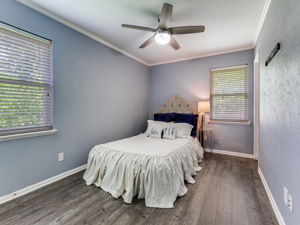 1106 Ridgeway Circle Richardson, TX 75080 - Photo 19 of 25 Bedroom with ornamental molding, dark wood-style floors, a ceiling fan, and a textured wall