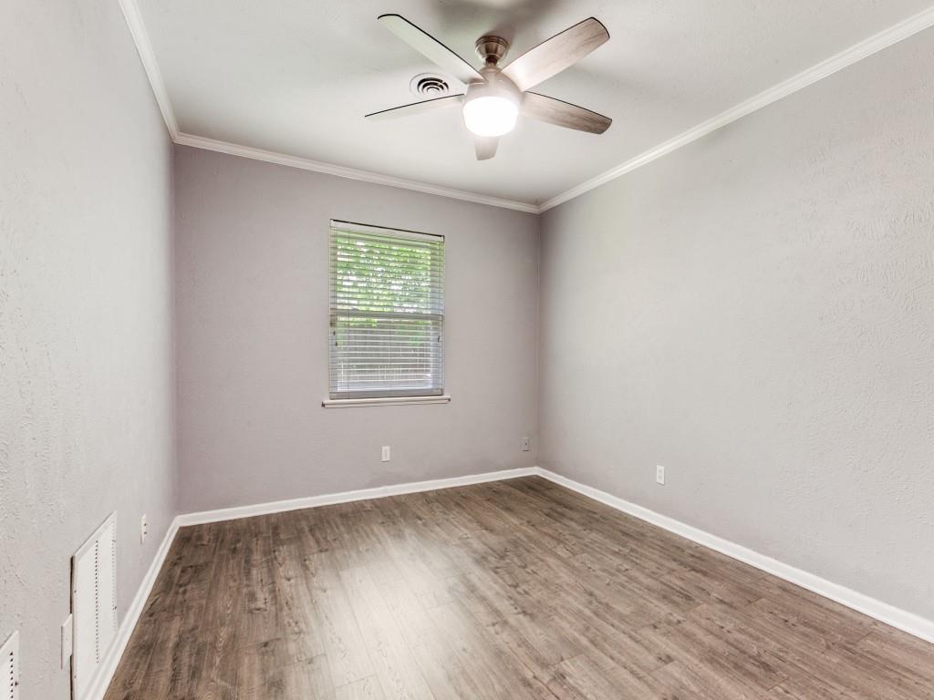 1106 Ridgeway Circle Richardson, TX 75080 - Photo 21 of 25 Unfurnished room with crown molding, wood finished floors, a textured wall, and a ceiling fan