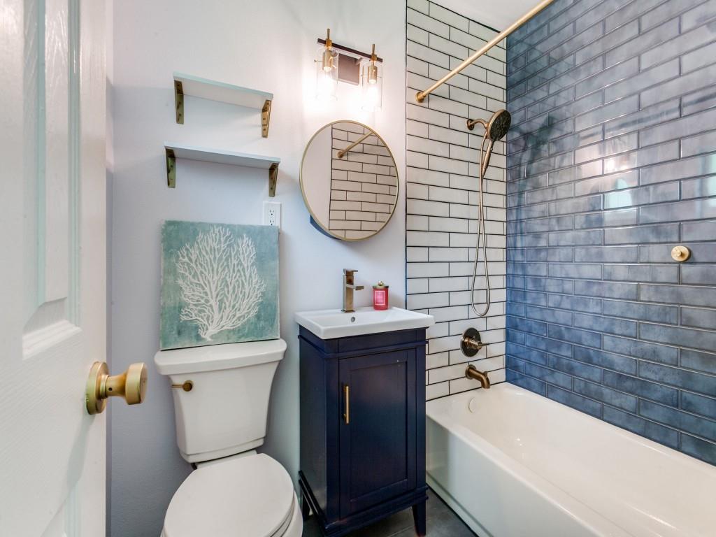 1106 Ridgeway Circle Richardson, TX 75080 - Photo 3 of 25 Full bathroom featuring vanity and bathtub / shower combination