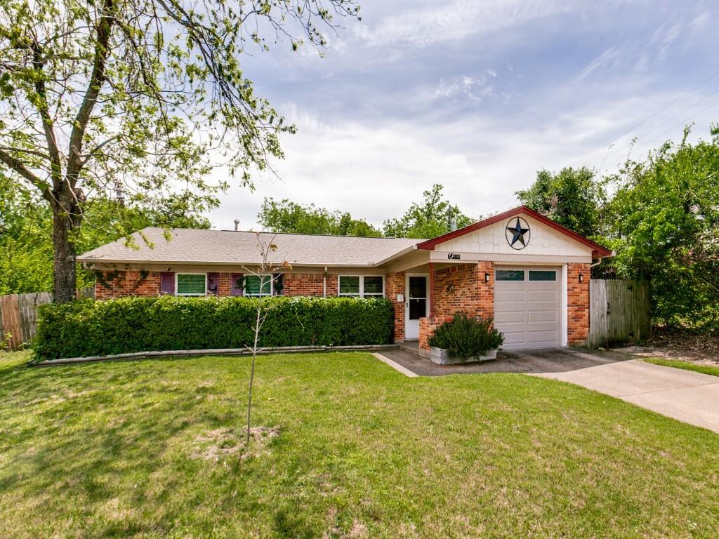 1106 Ridgeway Circle Richardson, TX 75080 - Photo 5 of 25 Ranch-style house with brick siding, an attached garage, and concrete driveway