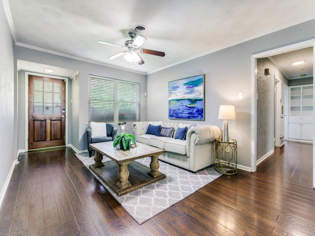 1106 Ridgeway Circle Richardson, TX 75080 - Photo 7 of 25 Living area featuring dark wood finished floors, a ceiling fan, and ornamental molding