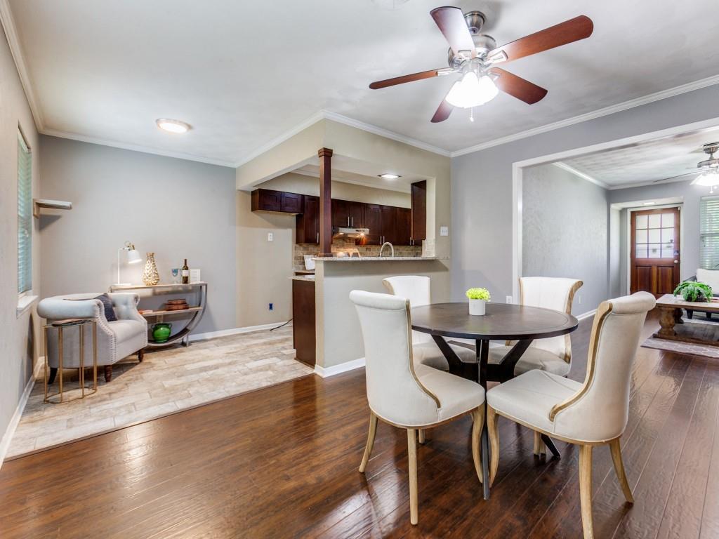 1106 Ridgeway Circle Richardson, TX 75080 - Photo 8 of 25 Dining area featuring ornamental molding, dark wood-style flooring, and a ceiling fan
