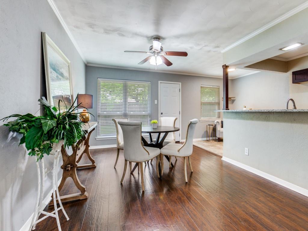 1106 Ridgeway Circle Richardson, TX 75080 - Photo 9 of 25 Dining space featuring dark wood-style floors, ceiling fan, crown molding, and a textured wall