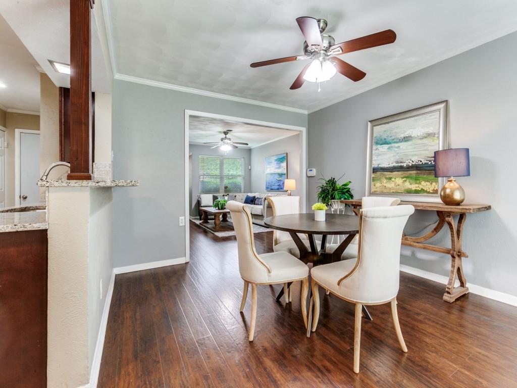 1106 Ridgeway Circle Richardson, TX 75080 - Photo 10 of 25 Dining area featuring dark wood-style flooring, ceiling fan, and ornamental molding