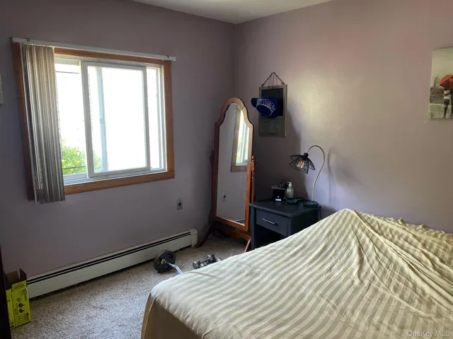 a bedroom with a bed and a closet