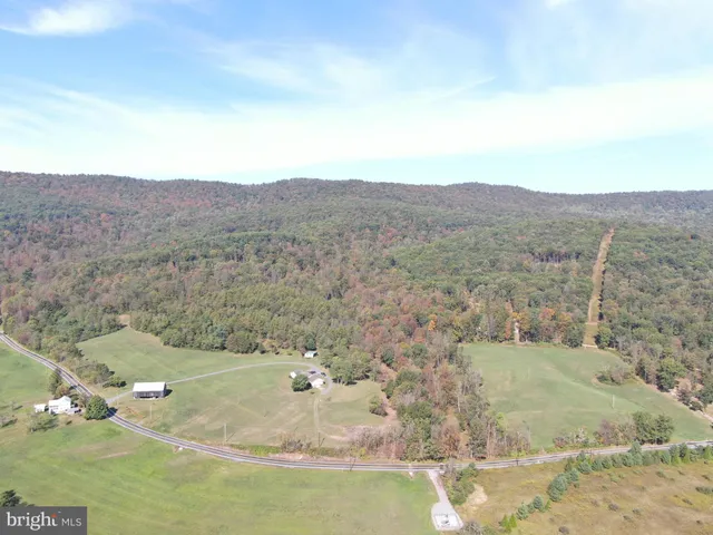 a view of a backyard with wooden floor and mountain view