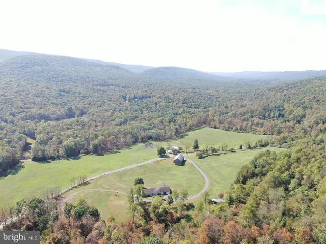 a view of a field with an ocean