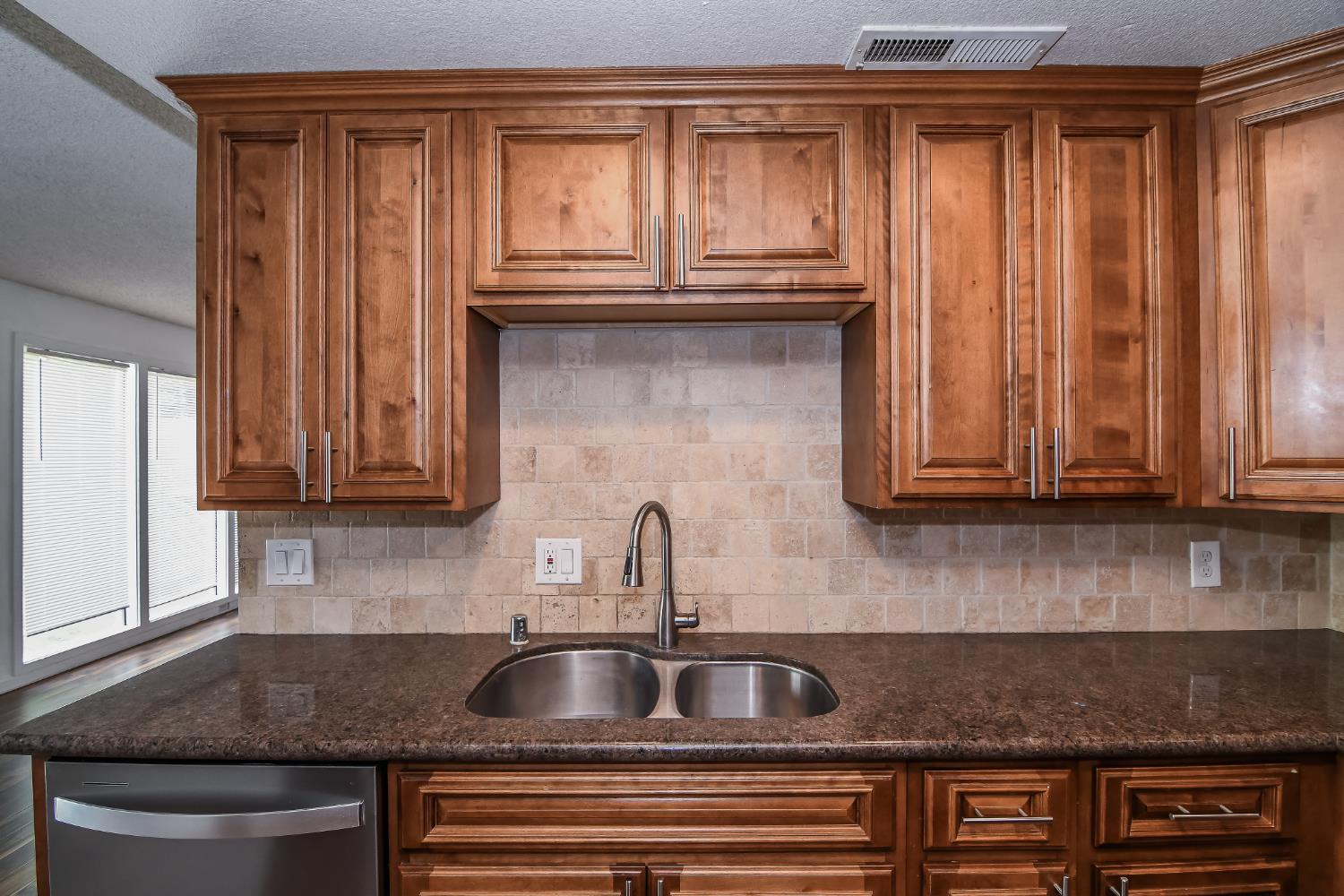 1139 Rivara Circle Sacramento, CA 95864 - Photo 22 of 72 a kitchen with granite countertop a sink and cabinets