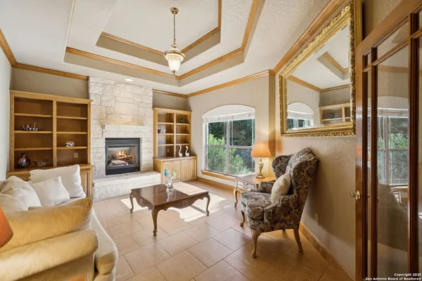 a living room with furniture and a fireplace