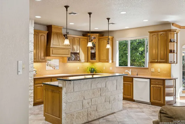 a kitchen with a sink and window