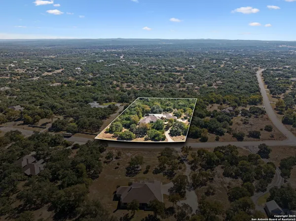 an aerial view of house with yard