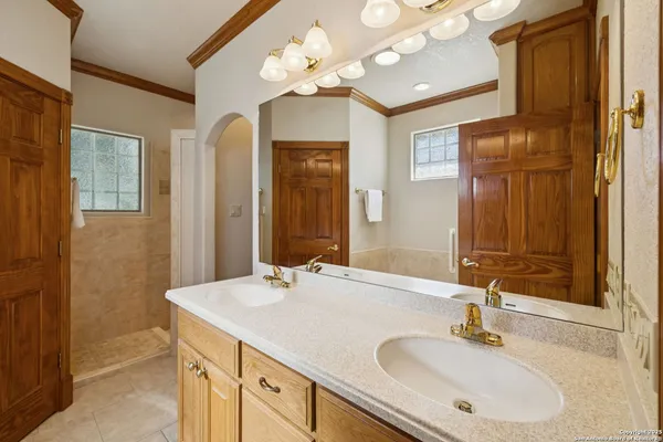 a bathroom with a sink vanity and a mirror