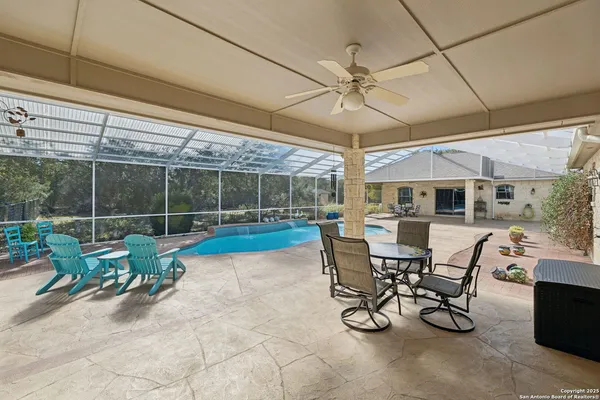 a view of a patio with a table and chairs