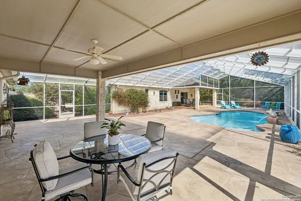 a view of a patio with couches table and chairs
