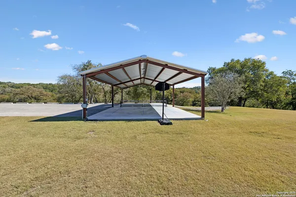 a view of a swimming pool with an outdoor space and seating area