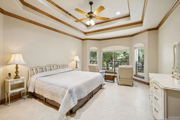 a bed room with a bed and a chandelier