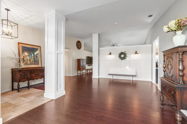 a view of an entryway with wooden floor